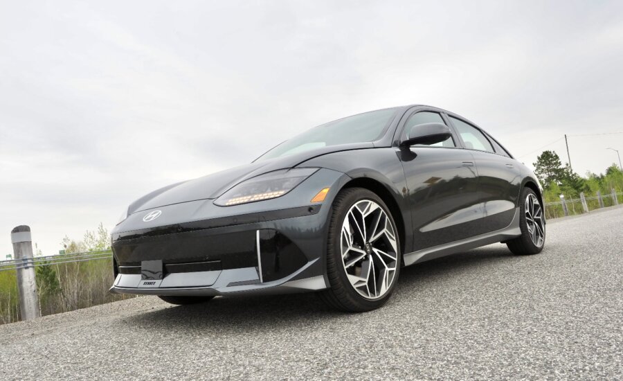 A black Ioniq 6 sedan sits on a street