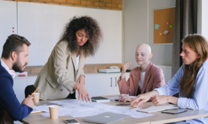 Coworkers discuss their retirement savings plans.