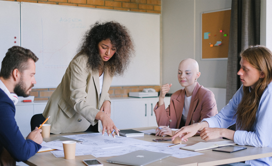 Coworkers discuss their retirement savings plans.