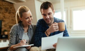 A couple reviews their mortgage options over a cup of coffee