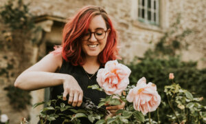 Woman pruning flowers to symbolize receiving dividends from Canadian ETFs