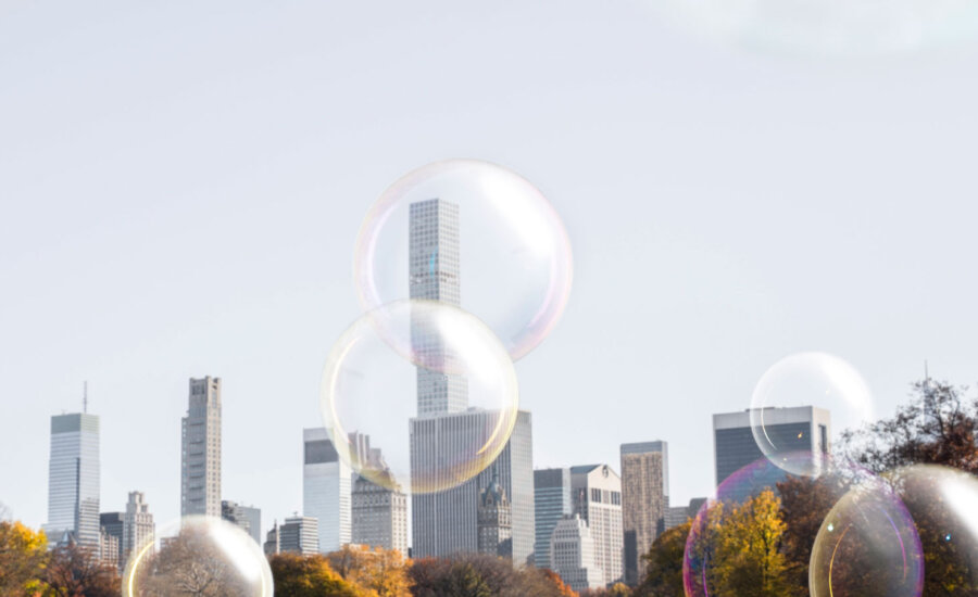 Bubbles in front of tall corporate buildings