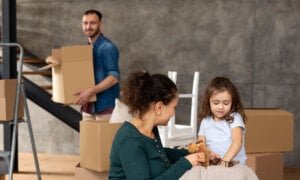 Family moving into a new home, anticipating their mortgage interest based on the Bank of Canada's March 6, 2024 policy rate announcement.