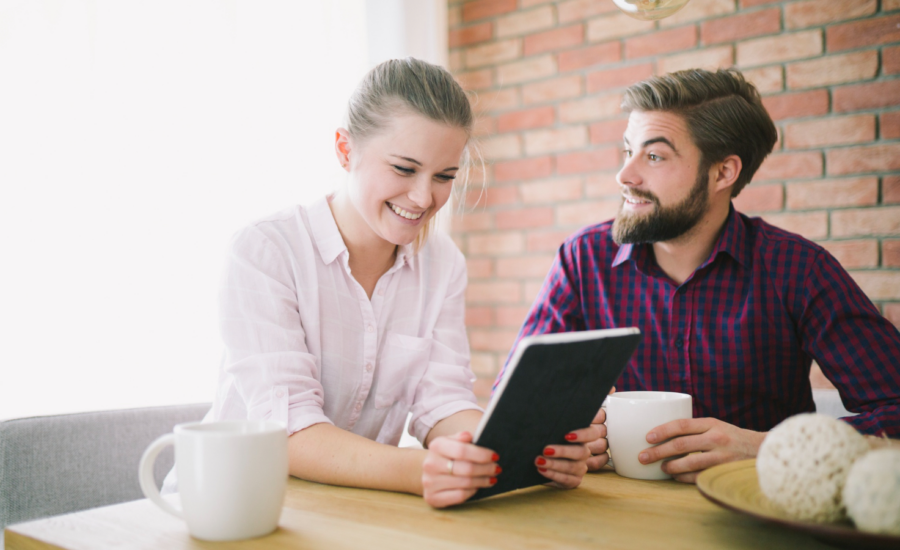 A young couple talks about finances over coffee