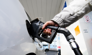 The hand of a person filling up their car's gas tank