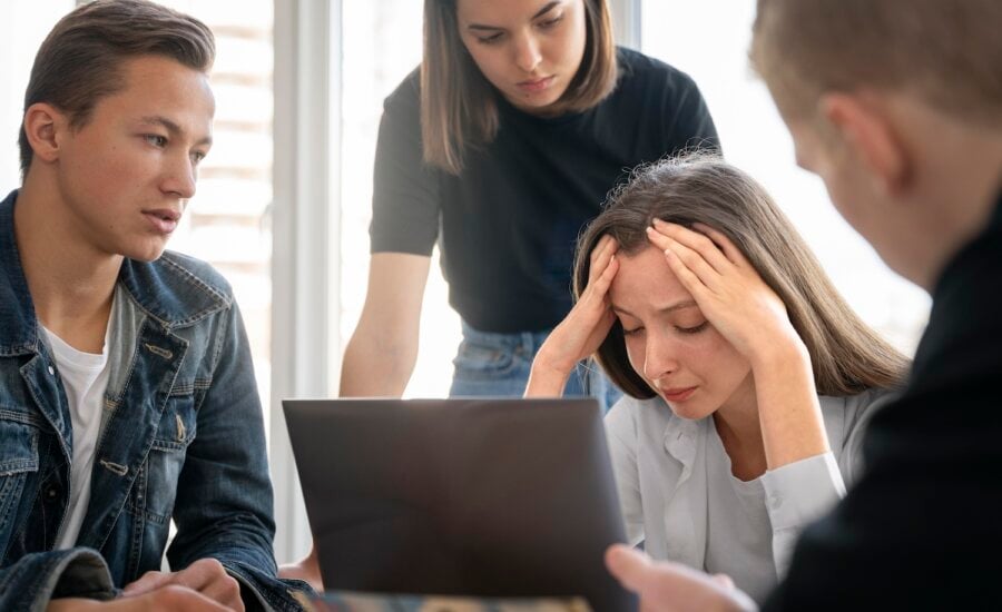 Grieving family gathers around computer to sort through their parents' estate