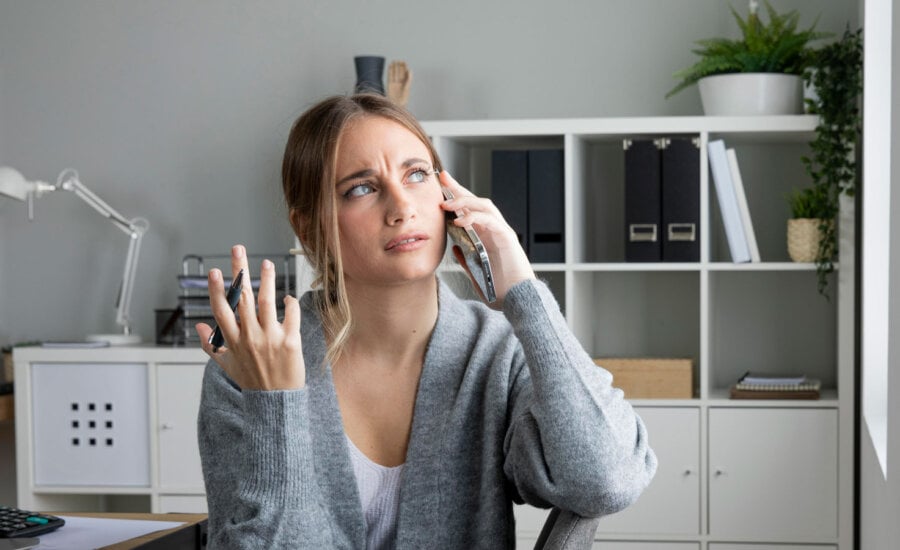 A woman on her phone trying to get the money back from a scam.