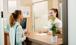A healthcare receptionist, one of the industries that had employment growth.