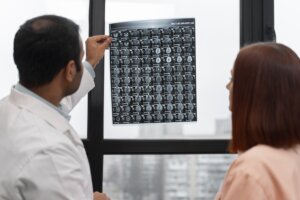 Doctors examine an x-ray slide