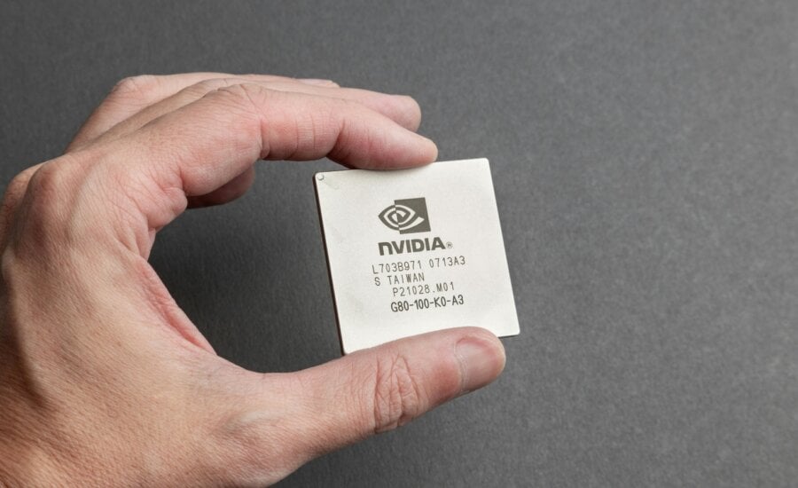 A person is seen holidng a Nvidia computer chip