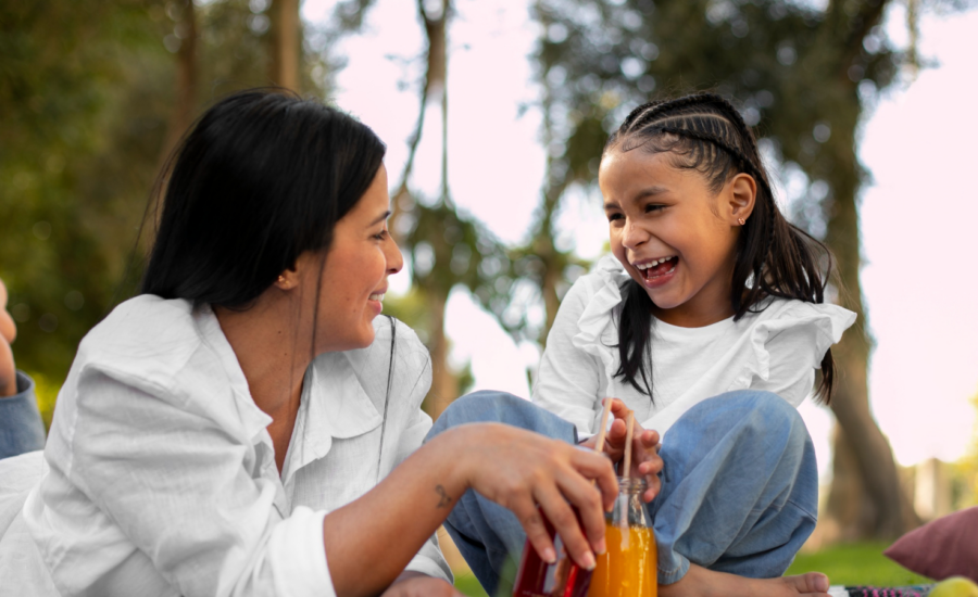 A young mom and her daughter in a park