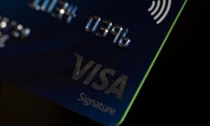 A Visa card is seen in Portland, Ore.,