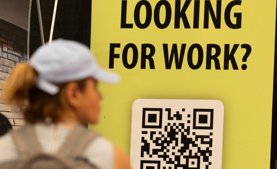 People attend a job and continuing education fair in Montreal on Thursday, Oct. 5, 2023.