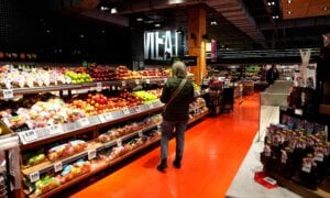 A customer looks for produce at a grocery store in Ottawa, on Wednesday, April 2, 2025.