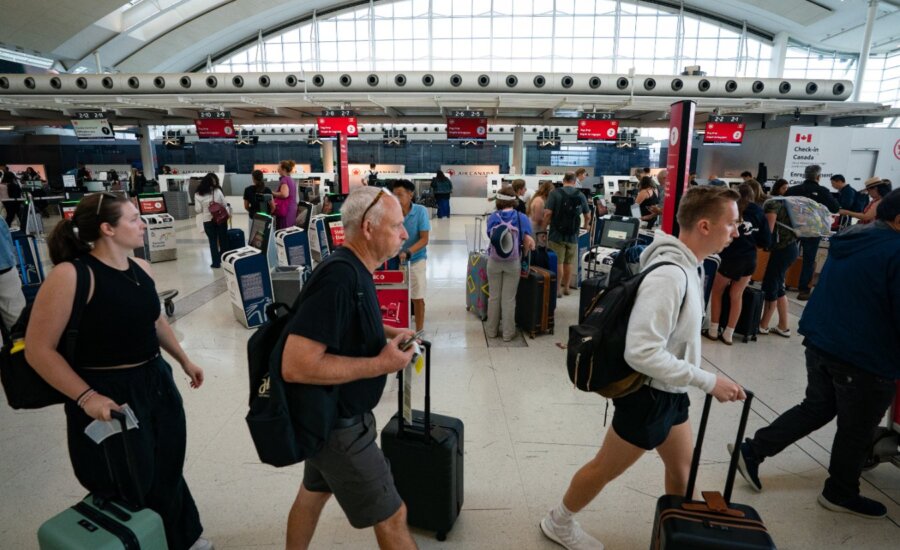 The Air Canada check-in area inside Terminal 1 of Toronto Pearson International Airport is pictured in Mississauga, Ont., on Wednesday, Aug. 13, 2025.