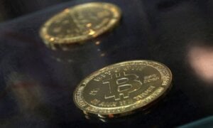 Two bitcoins on a dark background