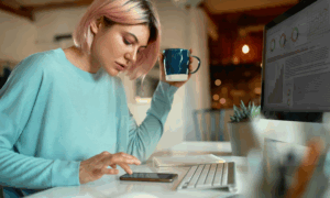 A young woman looks at social media on her phone