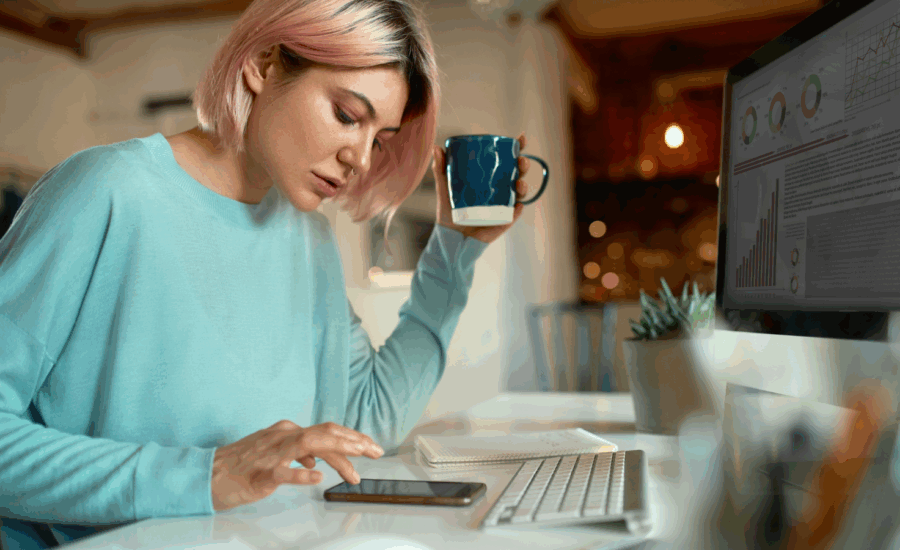 A young woman looks at social media on her phone
