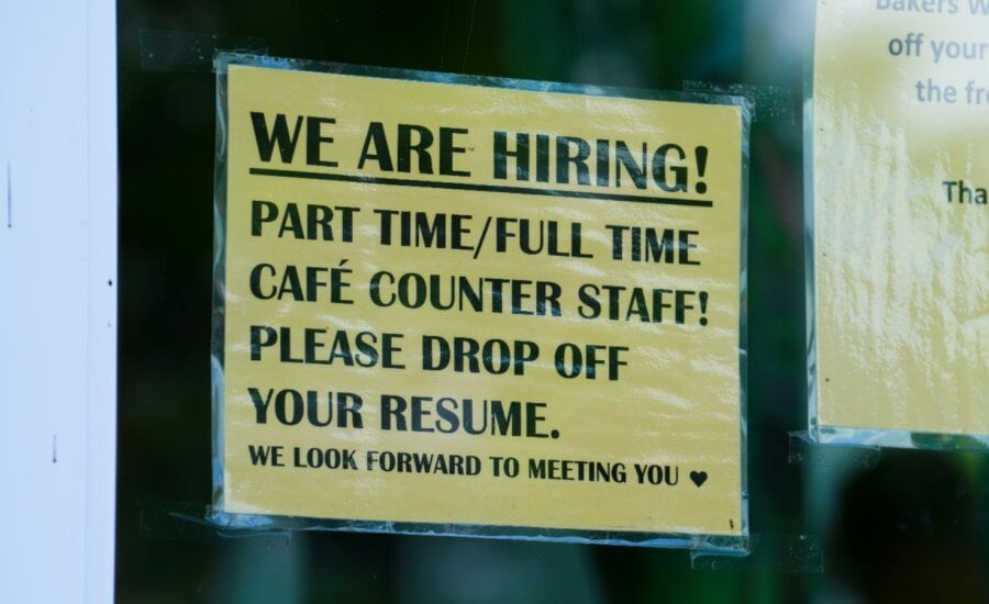 A sign for help wanted is pictured in a business window in Ottawa on Tuesday, July 12, 2022.
