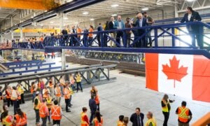 Prime Minister Mark Carney greets workers at Walters Group Steel fabrication plant in Hamilton, Ont., Wednesday, July 16, 2025.