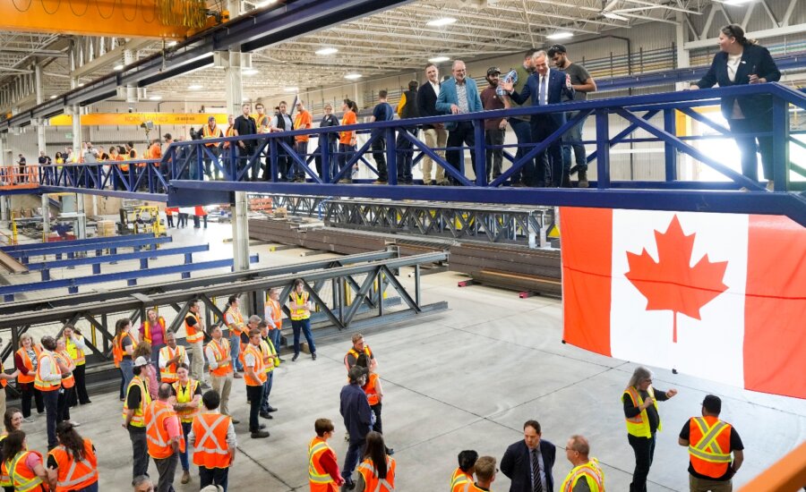 Prime Minister Mark Carney greets workers at Walters Group Steel fabrication plant in Hamilton, Ont., Wednesday, July 16, 2025.