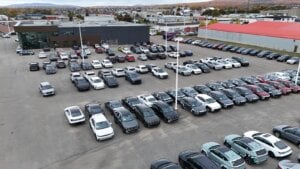 New cars, left, are parked at a car dealership on Friday October 11, 2024 in Quebec City.