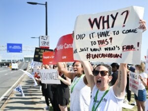 Air Canada flight attendants strike outside Montreal–Trudeau International Airport in Montreal, Saturday, Aug. 16, 2025.