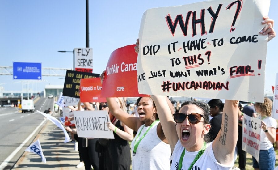 Air Canada flight attendants strike outside Montreal–Trudeau International Airport in Montreal, Saturday, Aug. 16, 2025.