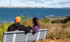 Finding out your partner has been keeping financial secrets from you — whether it's hiding debt, concealing big-ticket purchases, or had an undisclosed bank account — can be hurtful and even a deal breaker for many couples. A couple looks at the view along the shoreline in the Montreal suburb of Boucherville on the south shore of the St. Lawrence River on Wednesday, Oct. 8, 2025