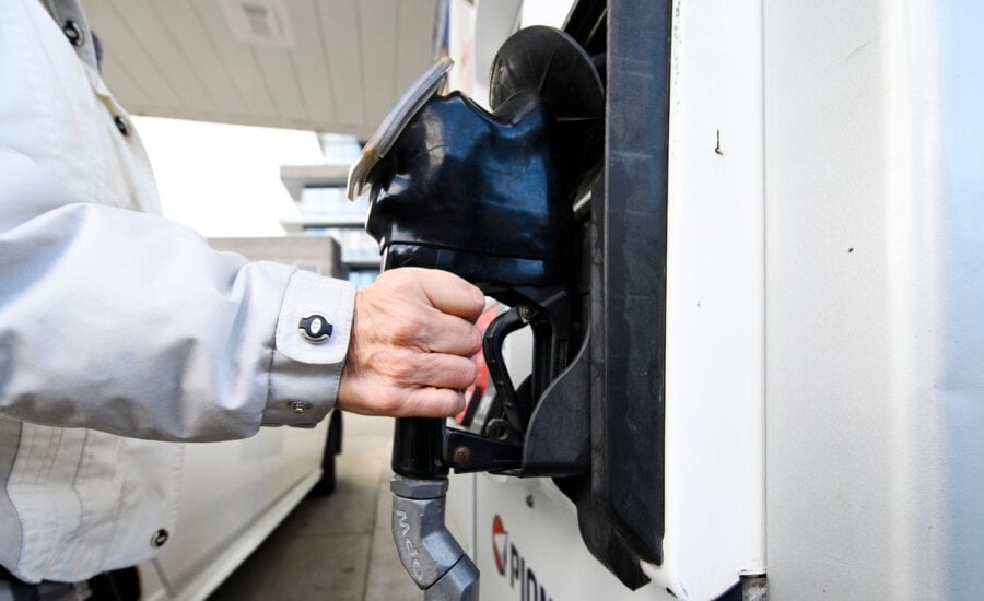 Eastern Canada provinces are going through a sticker shock of gas price hikes, with cars lining up at gas stations to get what they can before the price changes take effect. A person fills up at a gas station in Mississauga, Ont., Tuesday, Feb. 13, 2024.