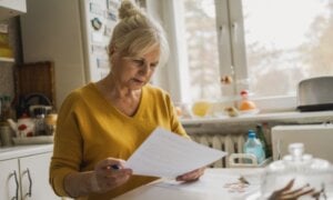 Older woman reading a paper