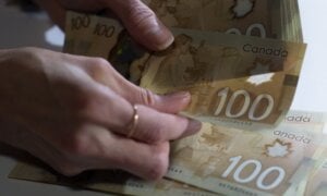 Canadian $100 bills are counted in Toronto, Feb. 2, 2016. In an era inundated with scams promising free money from Nigerian princes or easy millions if you just hand over a few crypto coins in advance, Sherry MacLennan and Lindsey Moore really might have money for you.
