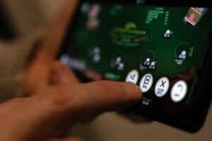 Canada's financial intelligence agency warns that illicit cash is being laundered through online gambling sites that offer a variety of ways to disguise shady funds. A "deal" button on a casino app in shown on a smartphone in a photo illustration made in Toronto, Wednesday, Jan. 17, 2024.