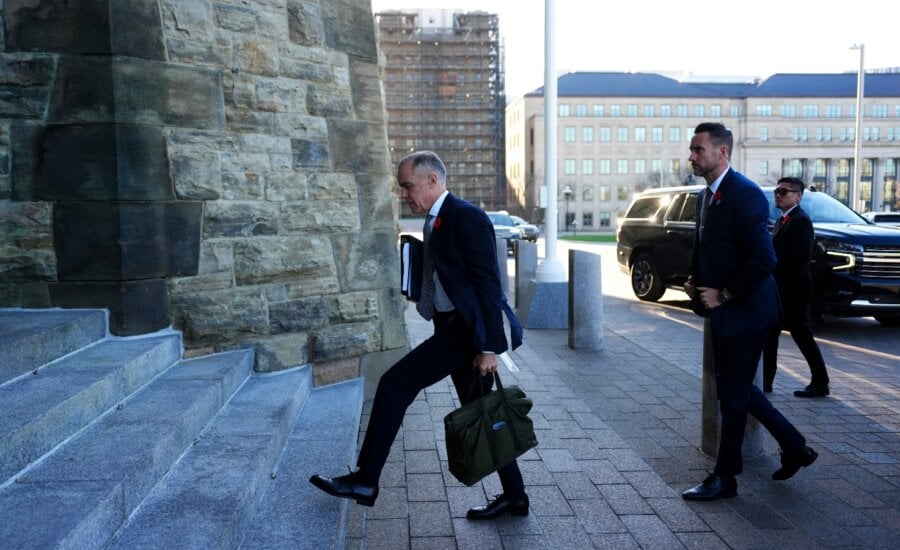 Prime Minister Mark Carney arrives at Parliament Hill in Ottawa on Tuesday, Nov. 4, 2025.