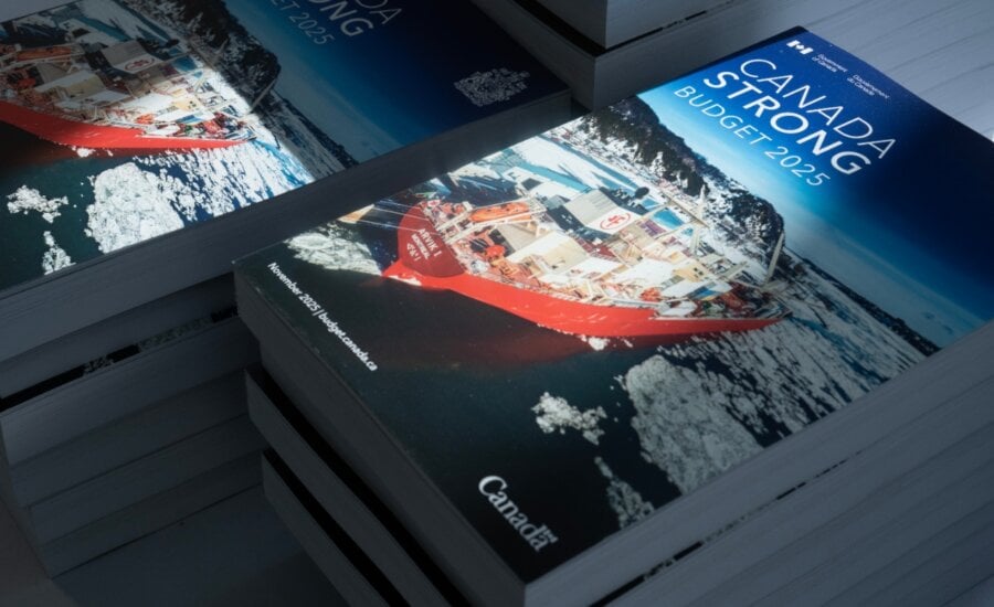 The federal budget is seen available for distribution on tables in Ottawa, Tuesday, Nov. 4, 2025.