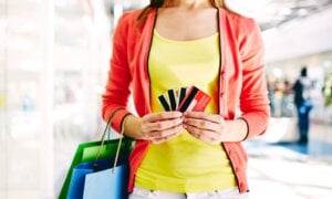 Woman holding multiple credit cards