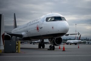 An Air Canada plane sits at Vancouver International Airport in Richmond, B.C., on Sunday, Aug. 17, 2025.