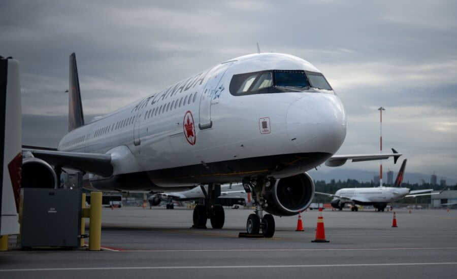 An Air Canada plane sits at Vancouver International Airport in Richmond, B.C., on Sunday, Aug. 17, 2025.