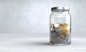 Coins in a glass jar, Money saving concept. 3D illustratio