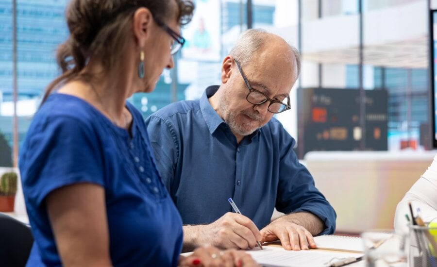 Senior man signing the new retirement plan contract with agency expert, agreeing on life insurance terms in modern office. Retired person collaborating with advisor to increase income. SSUCv3H4sIAAAAAAAAA41Uy47kKBD8lRZnI/E21GfsHkd94JGuRuPCJcA921uqf18BdrfqtjccJBkZkel8oBjQBWkLxNtAMQ+KYSGlwdbPDHsL1gBQrWdAEwq2ArpQzjVXkimtiTGEEDIhZ0v06PJAcV33UrOtcUvoQiaUIQXI/Qgh1i1Hu/YvZ6v/SPYG6ILuH5Sj54RKtXUvUFomKHd0Ic8JeVvhuuU44IPp16Ph6ILQhMru2uE5/U/sfUL2Csl/ocvj+WwlrmA76y80B0mc4wzbYGcsrJVY88ViUEapBfS8aIsmxEUIYLTF3geFhTUMu8UCBuEUZbOxlrcwJUFSZTXmkroWBth5TzChnkviuJM+oAlRoY3jzGDHZoXFTCS2yjG8uIVrxdgizIImpJUP1juGHV0WLAKZsSPzjL0DI4BZ6o1otTFvhRALpsxRLELg2FmiMFOzEwK4YFSj9wn9/lMh37qpf0OKW2761cwUbbewBsjr1wvm8vYbRhhVijfoL6gxQ+jWzYyzhsVU9myTh4ZqpjlpqN/2+9ohxg0TpmF32A5MEUJEg5aYbPJ9SBoqTA+8AdSYrh2TWndqGz5j2c5y5Ei42pSOEomZ50Gcyr5+PyecdPhmU/s2Ssoh+J875HqwMjXKy2VLBynhA0olDoxSqsfTe94WKA0/yqaSdzG5u3ODVF8M2pYl+kO2or1wt5eYoJRTNT3VHAg386n5fHnoWOMCby+WC24U1z1tidd0CqfS9EZsa2+XYkzLH8ehvBh+/iBNpp6N+jb3x0Zzuluz9cM4athozTUD/EQOicV+xnTtNFoc/eqrAq5fZ0p98rxw3GIIK7zZ6xi0No9Dyb2tmaNwJnps6aP85mON/8Jxd87vMe8tWspjCOqe4SVpU36oEVyOef6EUr+7qM3oekx+u42BnoWUs+jPb1uCIccYxYZD62rd1nbi6QgbhtolR2/Tm71BPwxWxhV6f05oqx9tkh/tz0k1f6ELorNoa/Keo++5Hm097qVut3FOW2197Muubv53DGVcjMX6EUvdWqIH2u/rZkPzs1/v7hZrPT8zfEb48xP9fD7/A9HEQpopBgAA