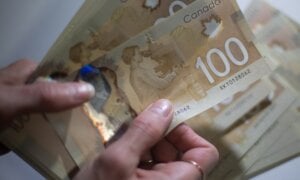 Canadian $100 bills are counted in Toronto on February 2, 2016.
