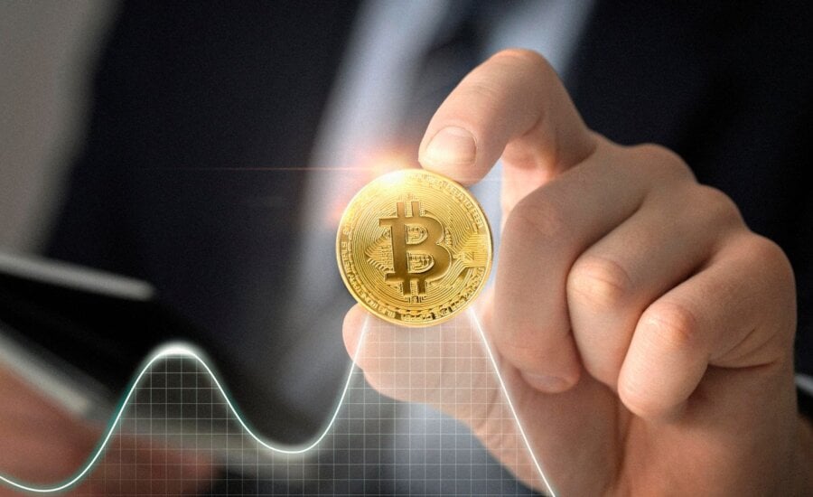 Person holding a physical Bitcoin