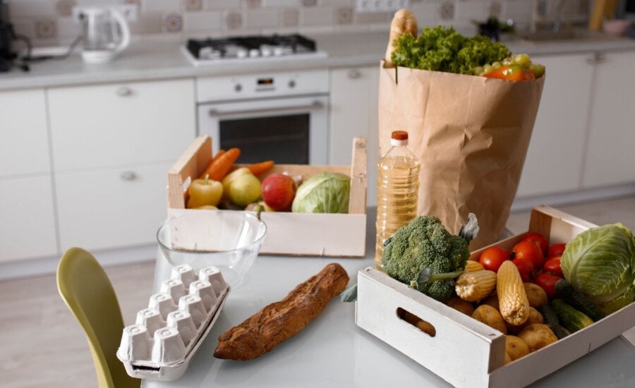 Groceries sitting on a kitchen counter