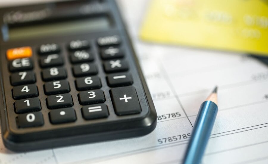 Calculator and pencil with some papers