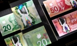 A magnifying glass enlarges the holographic image of Parliament Hill's Peace Tower on a 20 dollar bill issued by the Bank of Canada, shown in a display case at the Bank of Canada Museum in Ottawa, on Wednesday, Sept. 4, 2024.