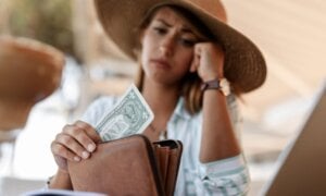 Woman concerned about the little money in her wallet