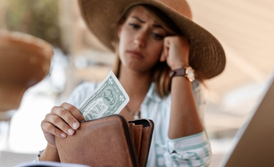 Woman concerned about the little money in her wallet
