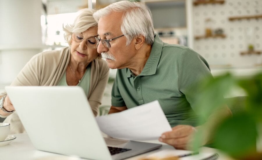 Senior couple reviews paperwork together