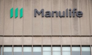 Signage is seen on Manulife Financial Corp.'s office tower in Toronto, Tuesday, Feb. 11, 2020.