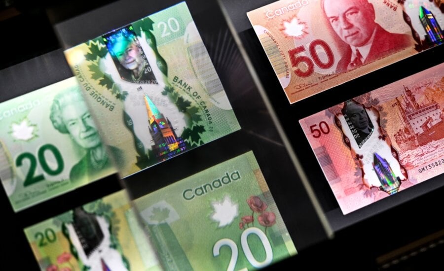 A magnifying glass enlarges the holographic image of Parliament Hill's Peace Tower on a 20 dollar bill issued by the Bank of Canada, shown in a display case at the Bank of Canada Museum in Ottawa, on Wednesday, Sept. 4, 2024.